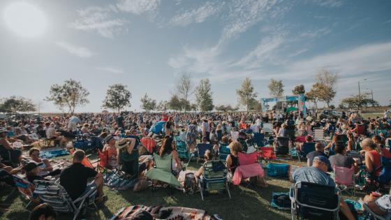 people sitting in lawn chairs