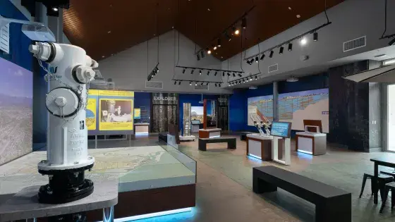 A blue fire hydrant sitting on top of a table. 