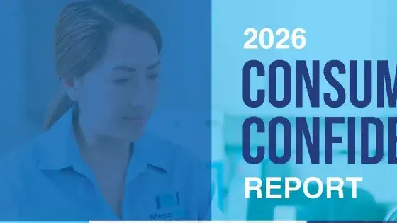 Image includes a woman looking at a computer with the text "2025 Consumer Confidence Report".